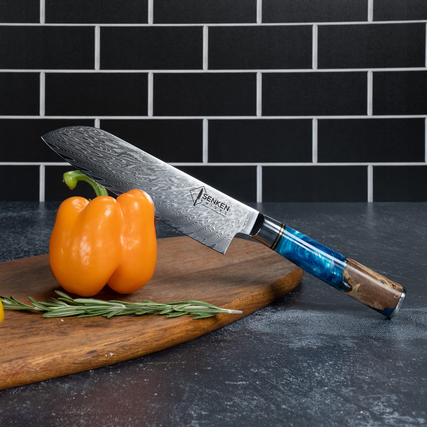 Senken Knives Tsunami paring knife image showcasing precise fruit peeling.