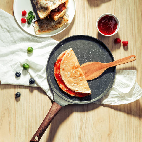 Wide edge design on the SENSARTE crepe pan supports batter control