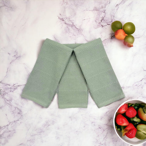 Serafina Home sage green towels reveal oversized 18x28 inch size for easy drying.