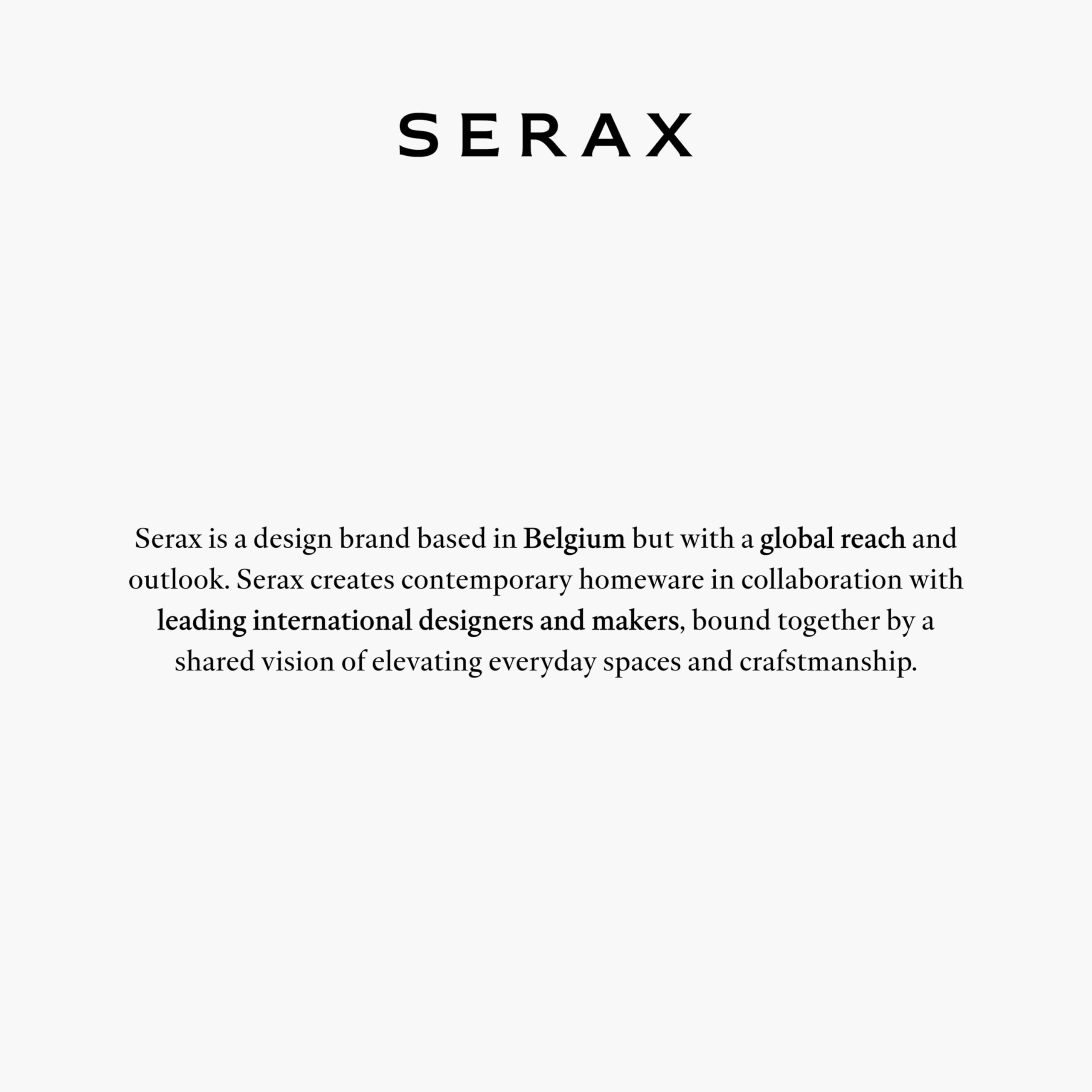 Serax Water pitcher used as vase, adds versatile decor.
