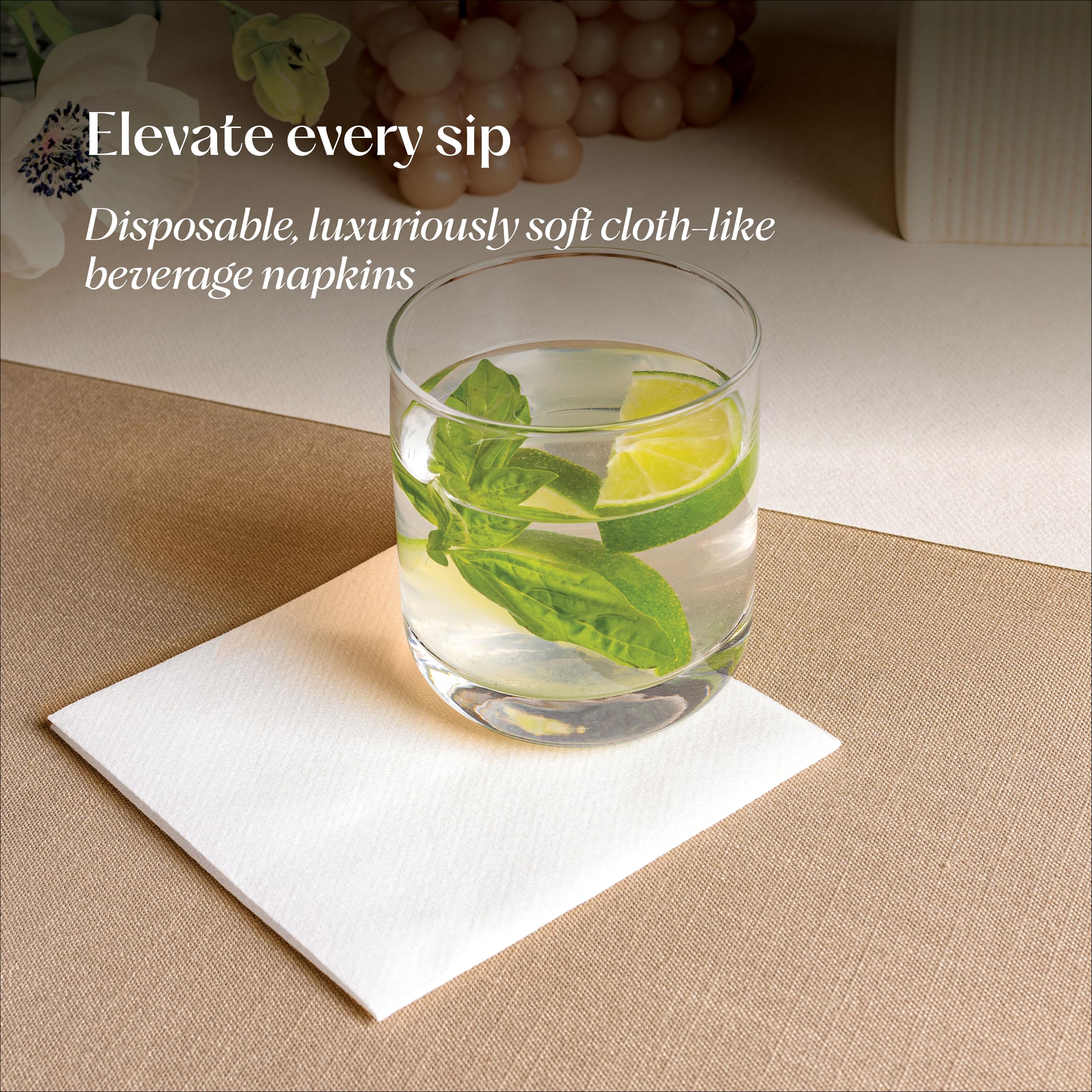 Servietto linen-feel beverage napkins unfolded 10x10 on a venue table.
