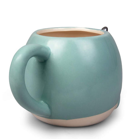 Seven20 Narwhal mug in use with tea for a cozy routine