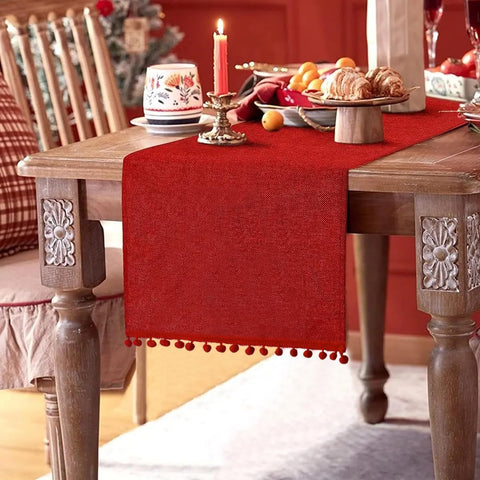 SevenFish Christmas table runner red burlap with pom-pom ends for festive dining