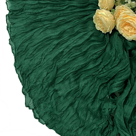 Holiday table styling with Seveups emerald green cheesecloth runner