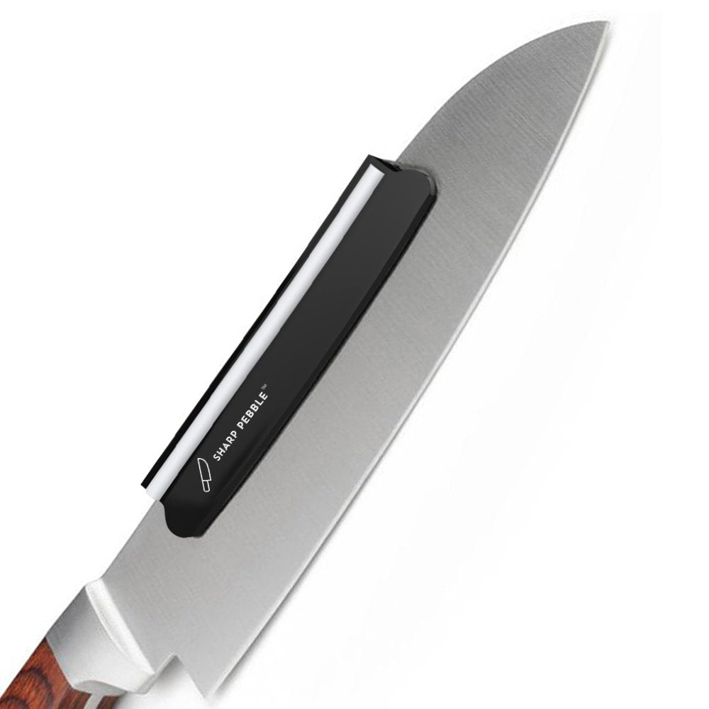 Sharp Pebble whetstone angle guide in use aids consistent 15–20 degree sharpening.