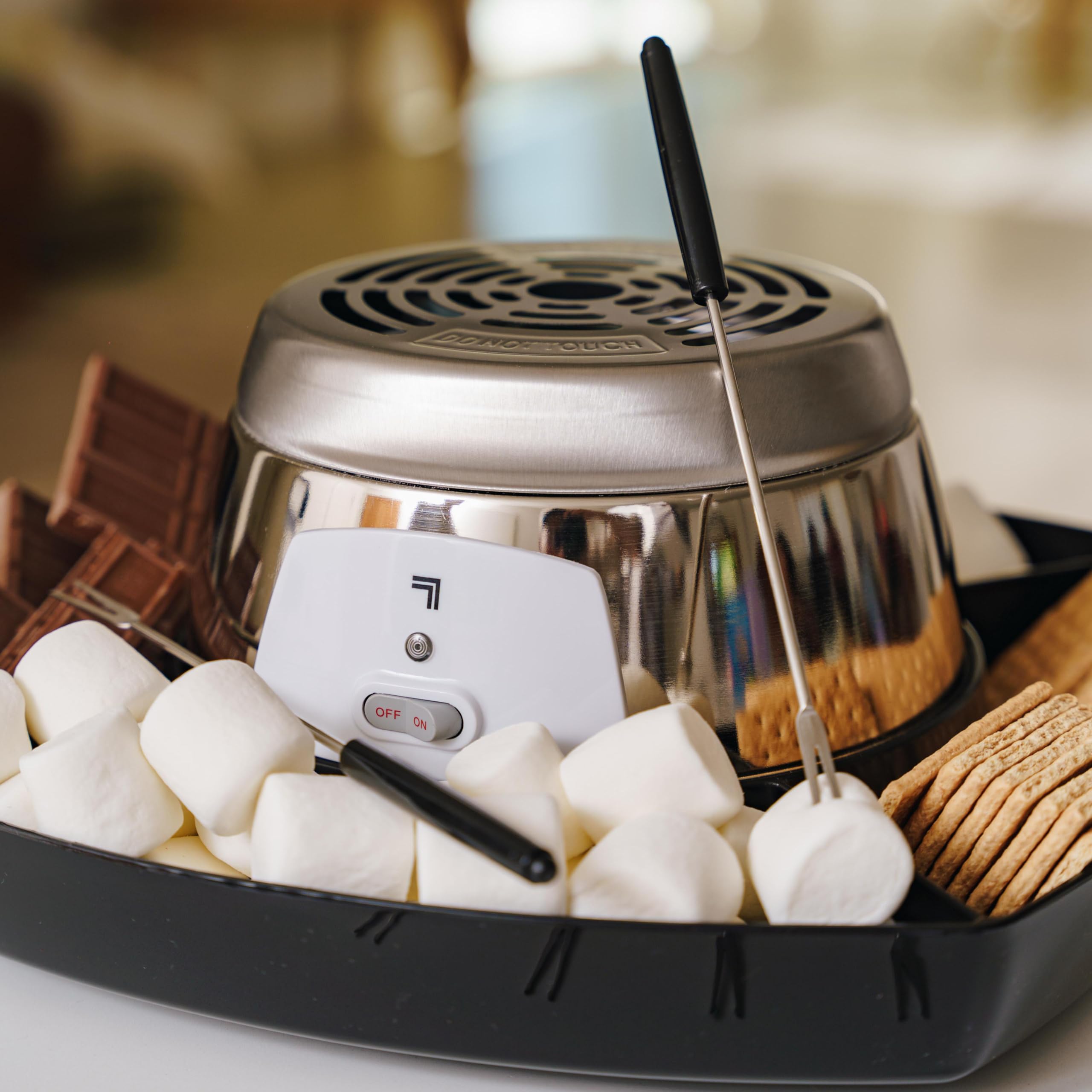 Sharper Image heating element provides consistent toasting for gooey marshmallows.