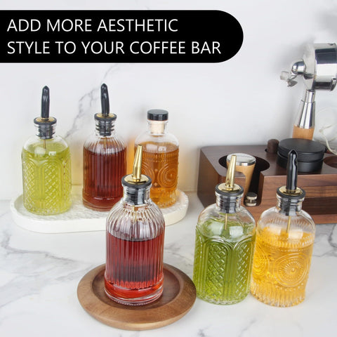 Shining Craft kitchen setup featuring six glass syrup bottles on counter.