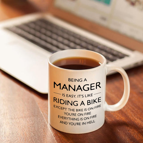 Shqiueos funny manager mug on a desk during office coffee break