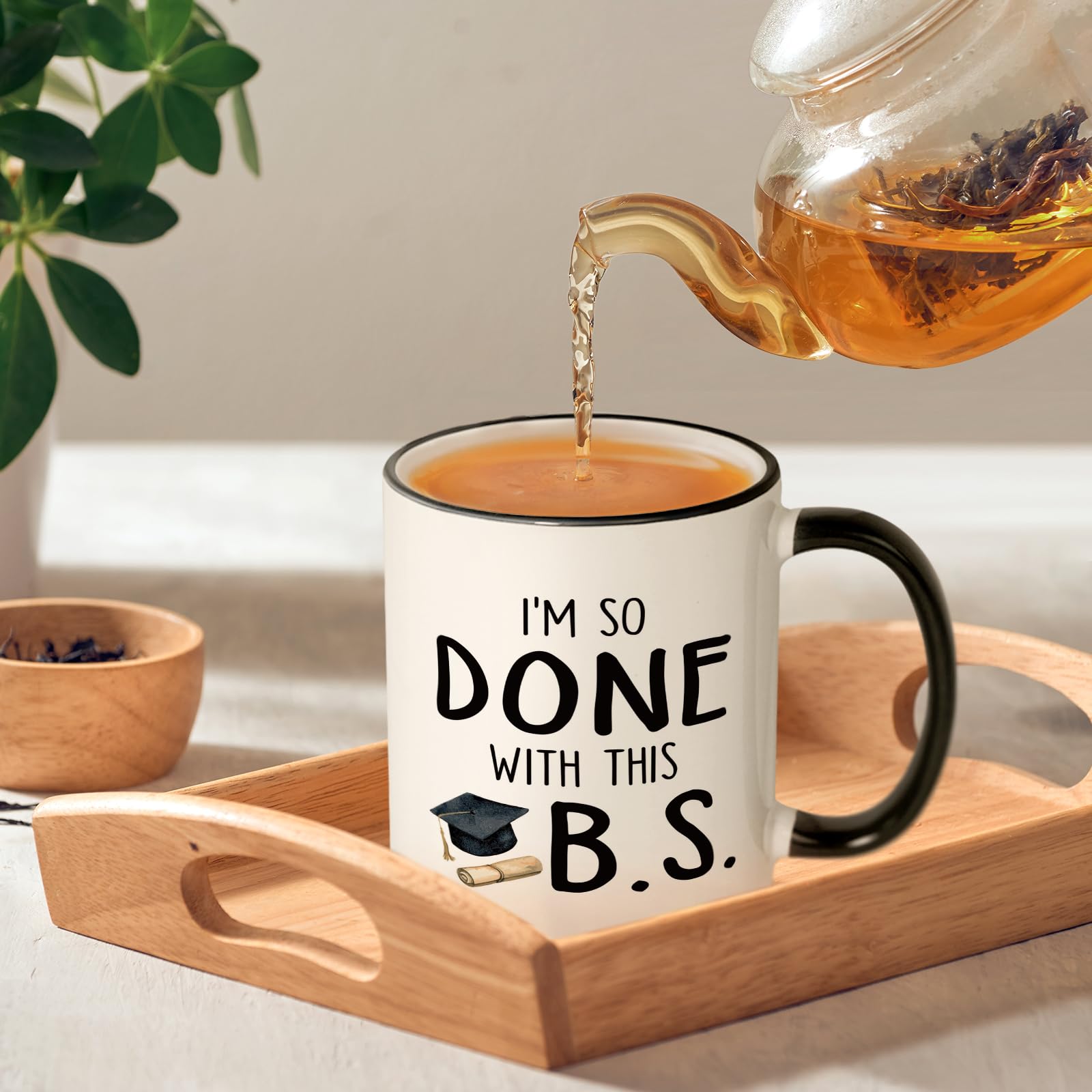 Shqiueos graduation mug featuring humorous artwork, a conversation starter.
