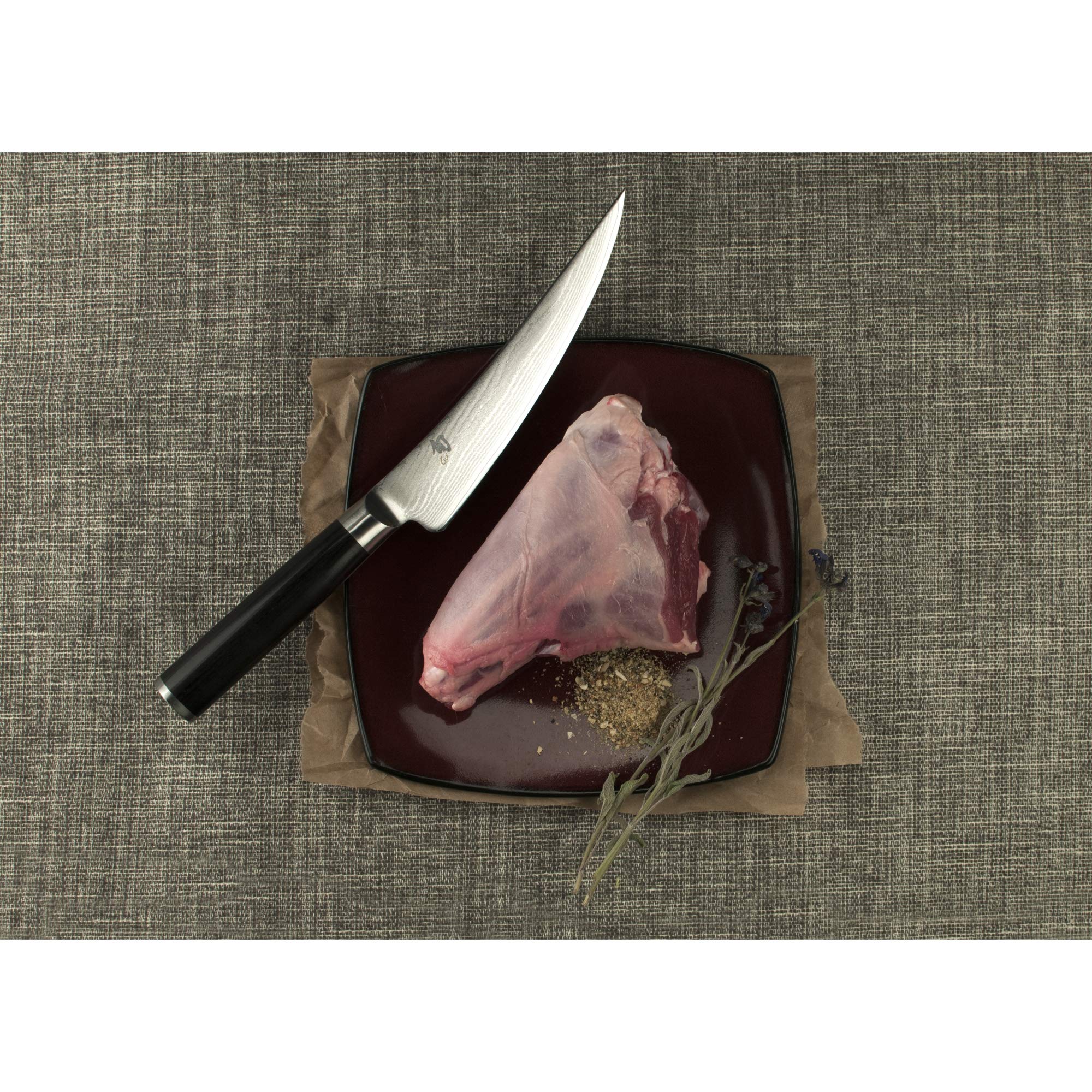Shun Classic 6-Inch Boning Knife handle close-up shows a comfortable grip.