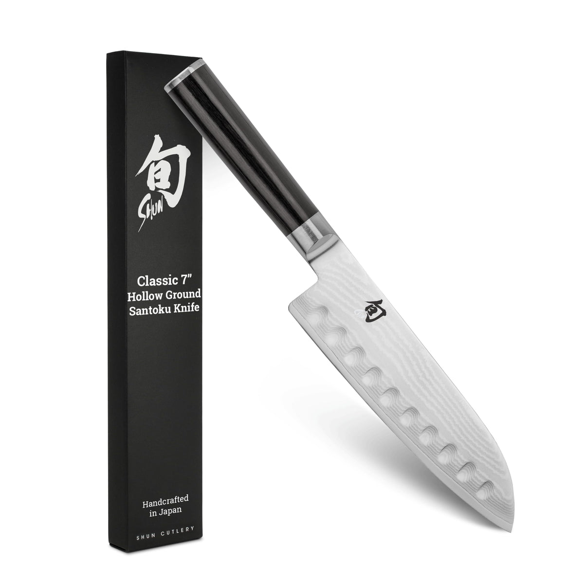 Shun Classic 7-inch hollow-ground santoku blade for smooth vegetable and protein slicing.