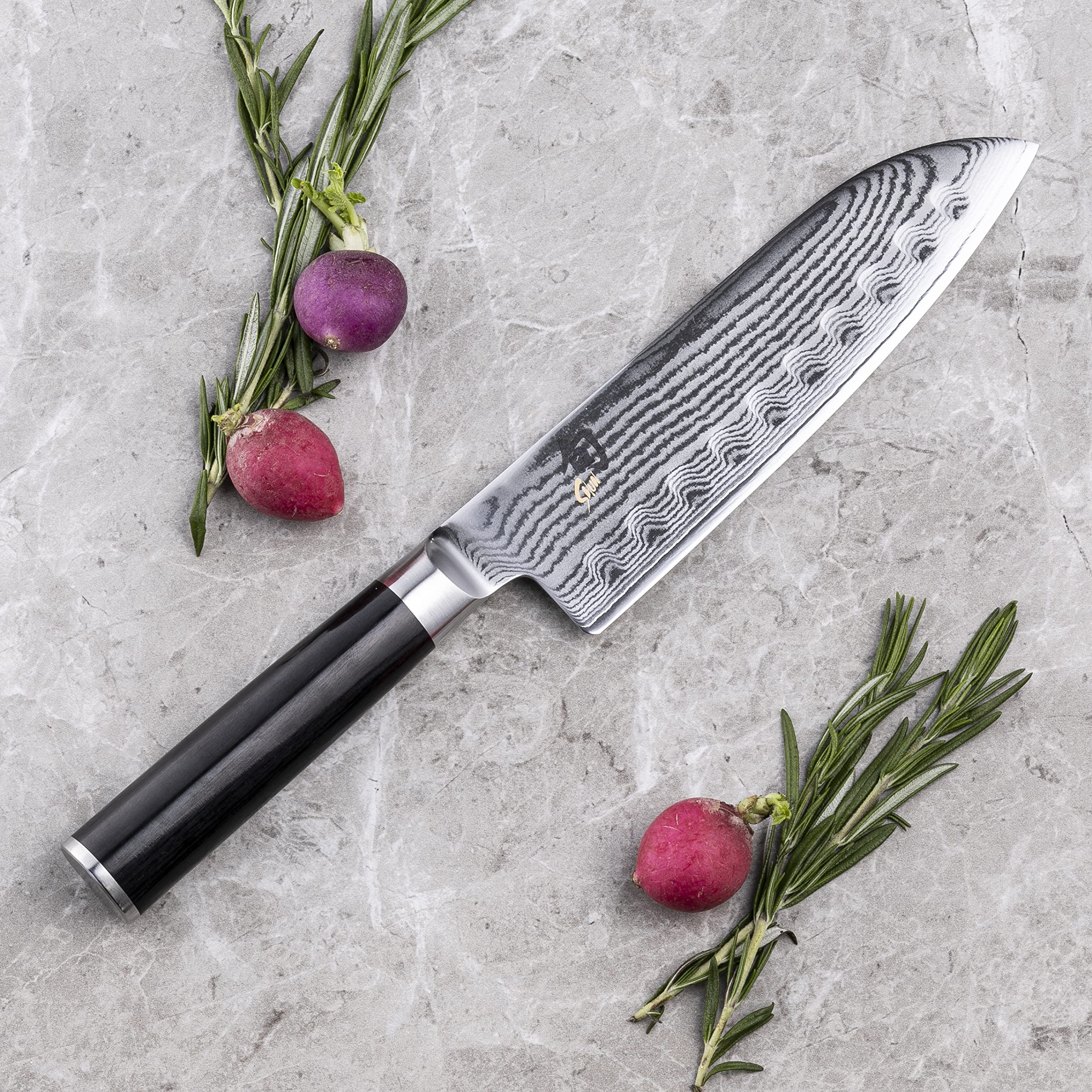 Shun Classic Damascus cladding with 68-layer pattern for beauty and food release.