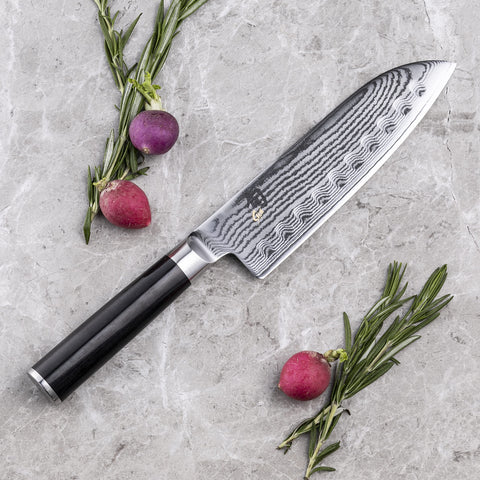 Shun Classic Damascus cladding with 68-layer pattern for beauty and food release.