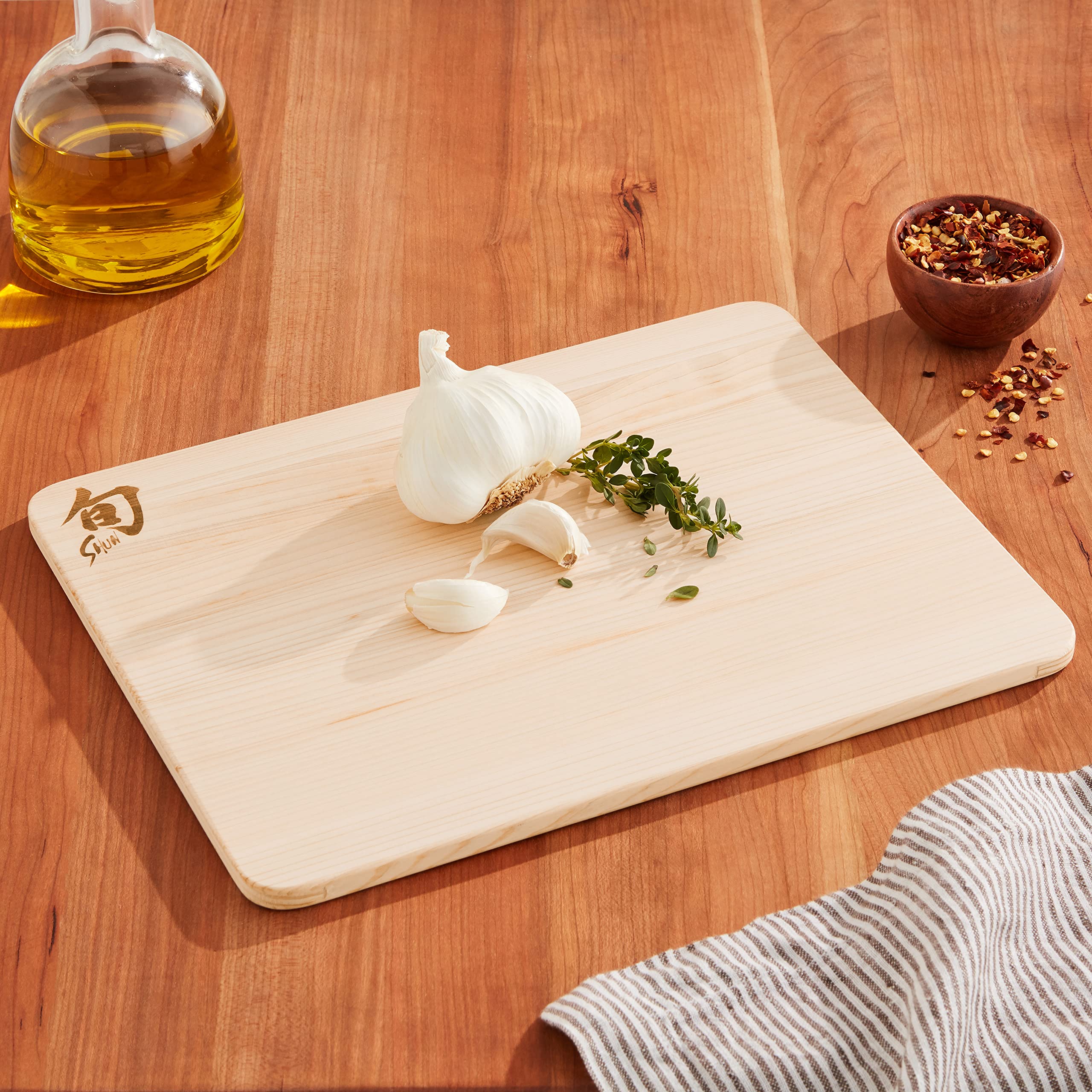 Shun Cutlery Hinoki edge detail highlighting knife-friendly, soft wood.