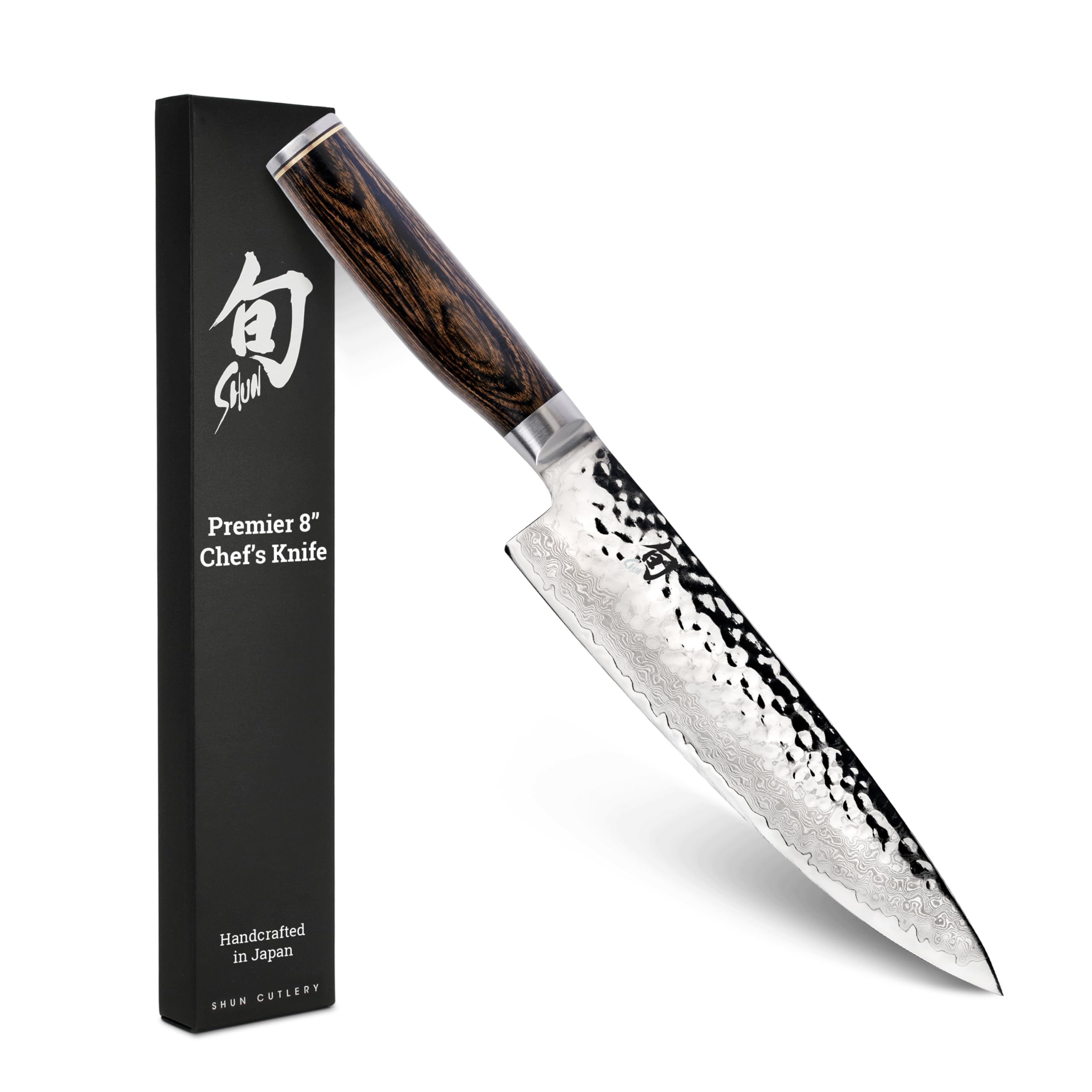 Shun Premier blade close-up with Damascus cladding for razor precision.