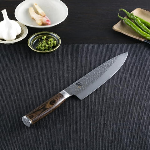 Shun Premier hammer finish tsuchime enhances smooth slicing.