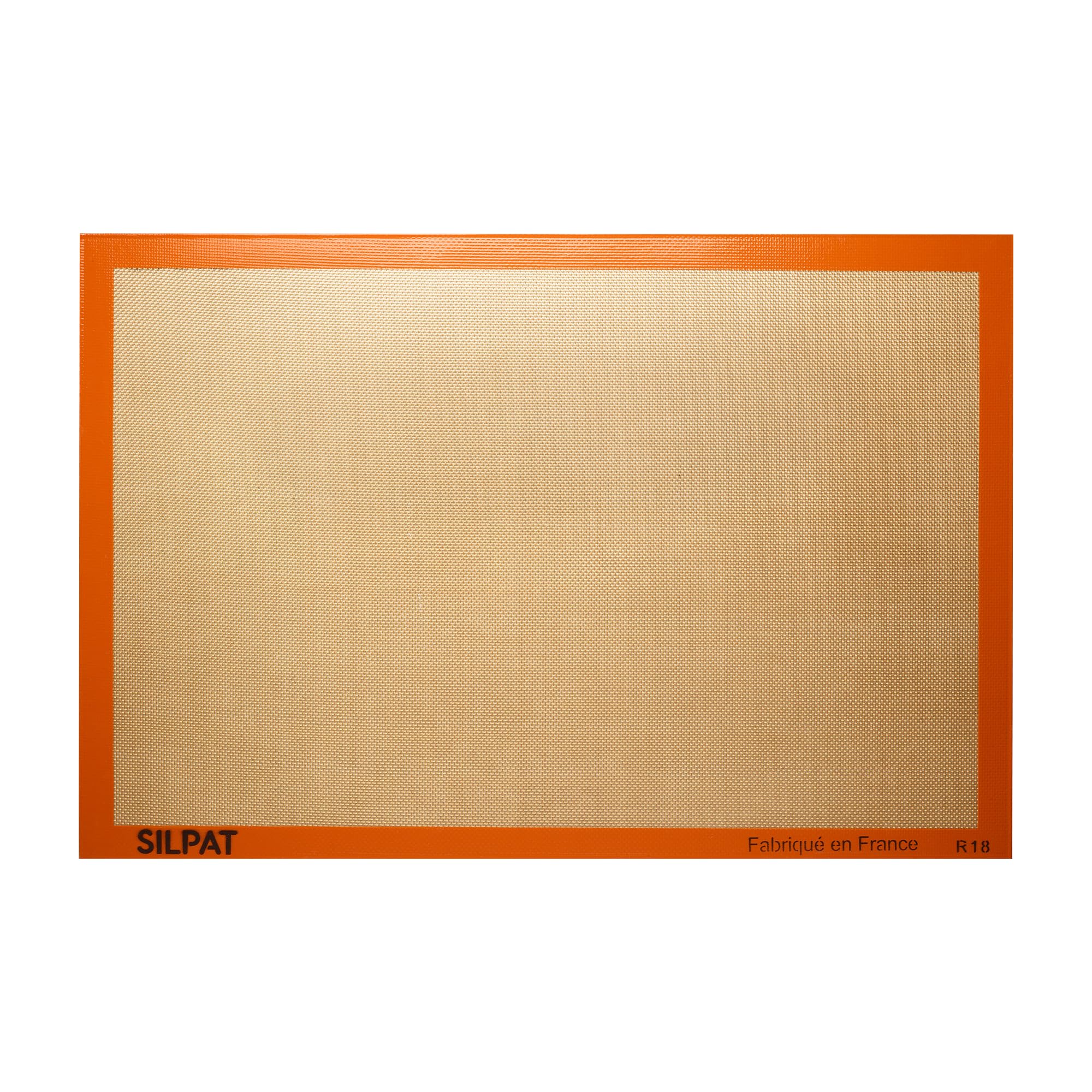 Silpat original non-stick baking mat fullsize on a sheet pan for easy release