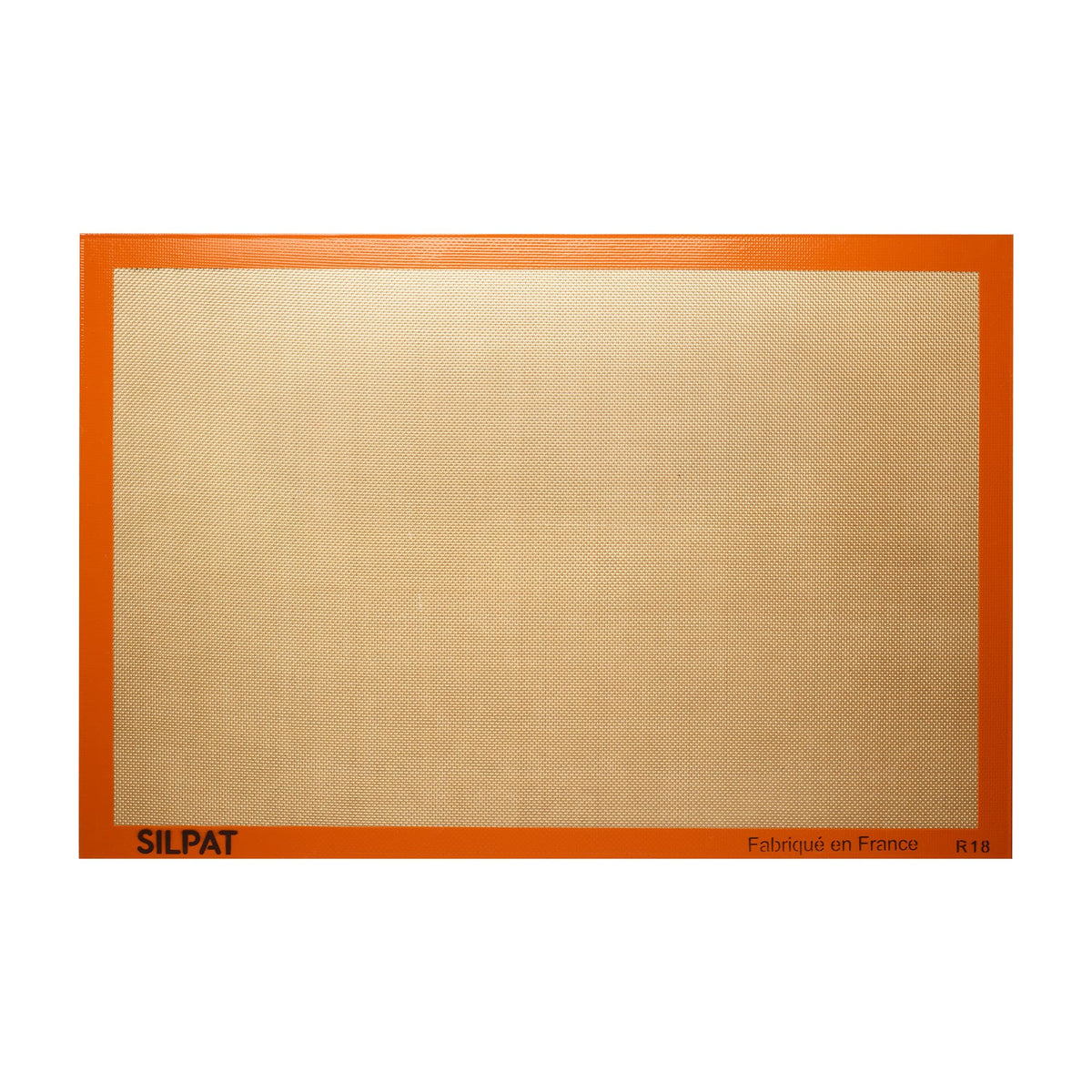 Silpat original non-stick baking mat fullsize on a sheet pan for easy release