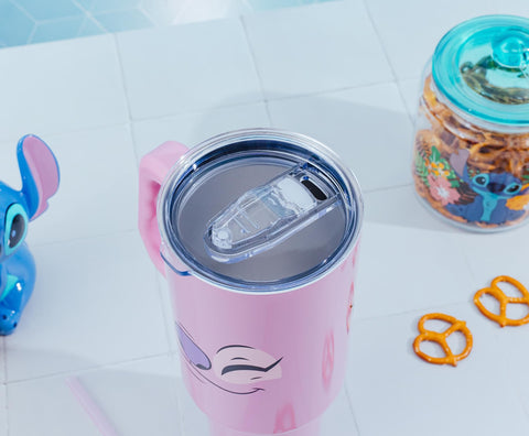 Hands hold 40oz Silver Buffalo tumbler showing large capacity