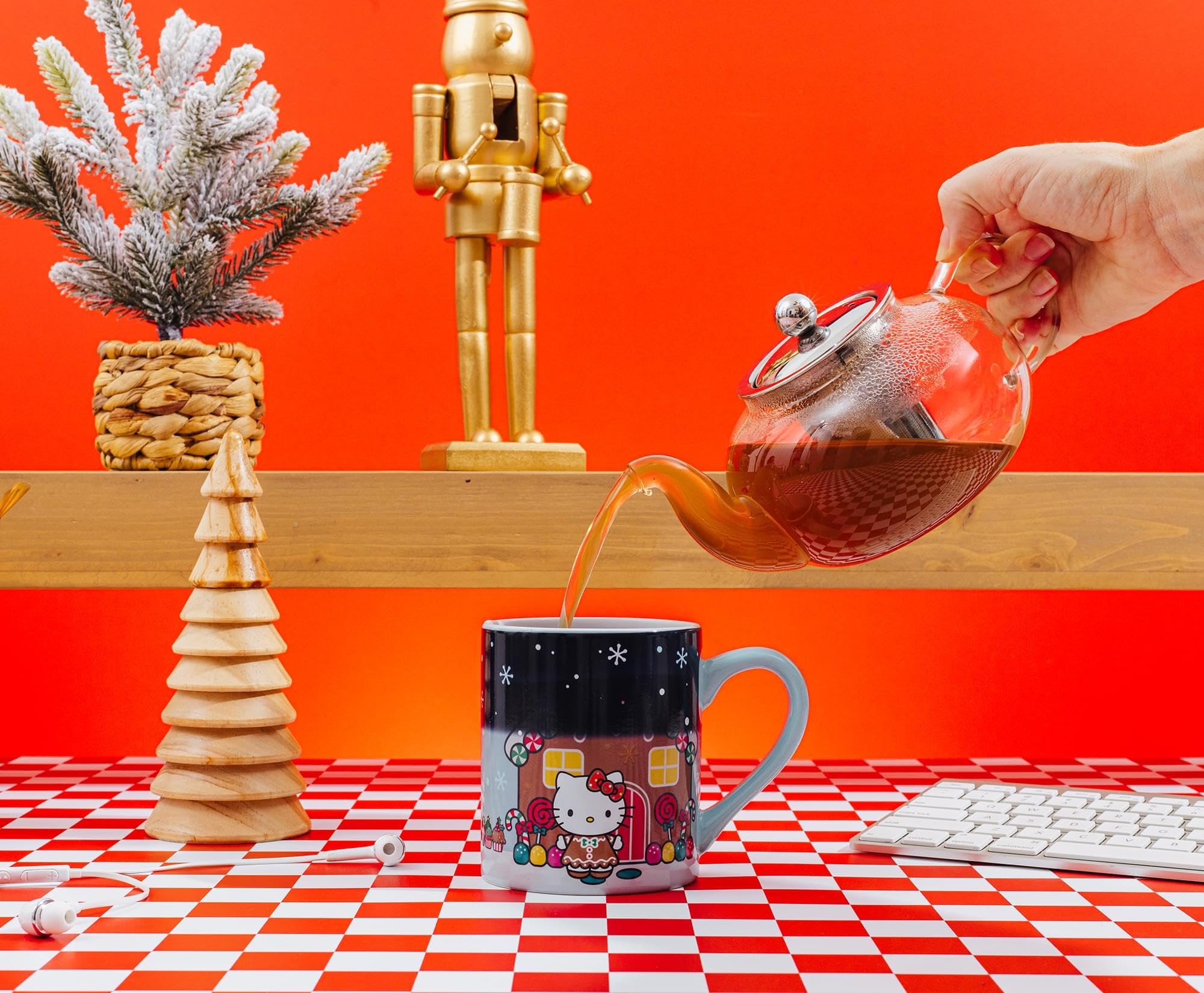 Hand wash only ceramic mug preserving Hello Kitty gingerbread artwork.