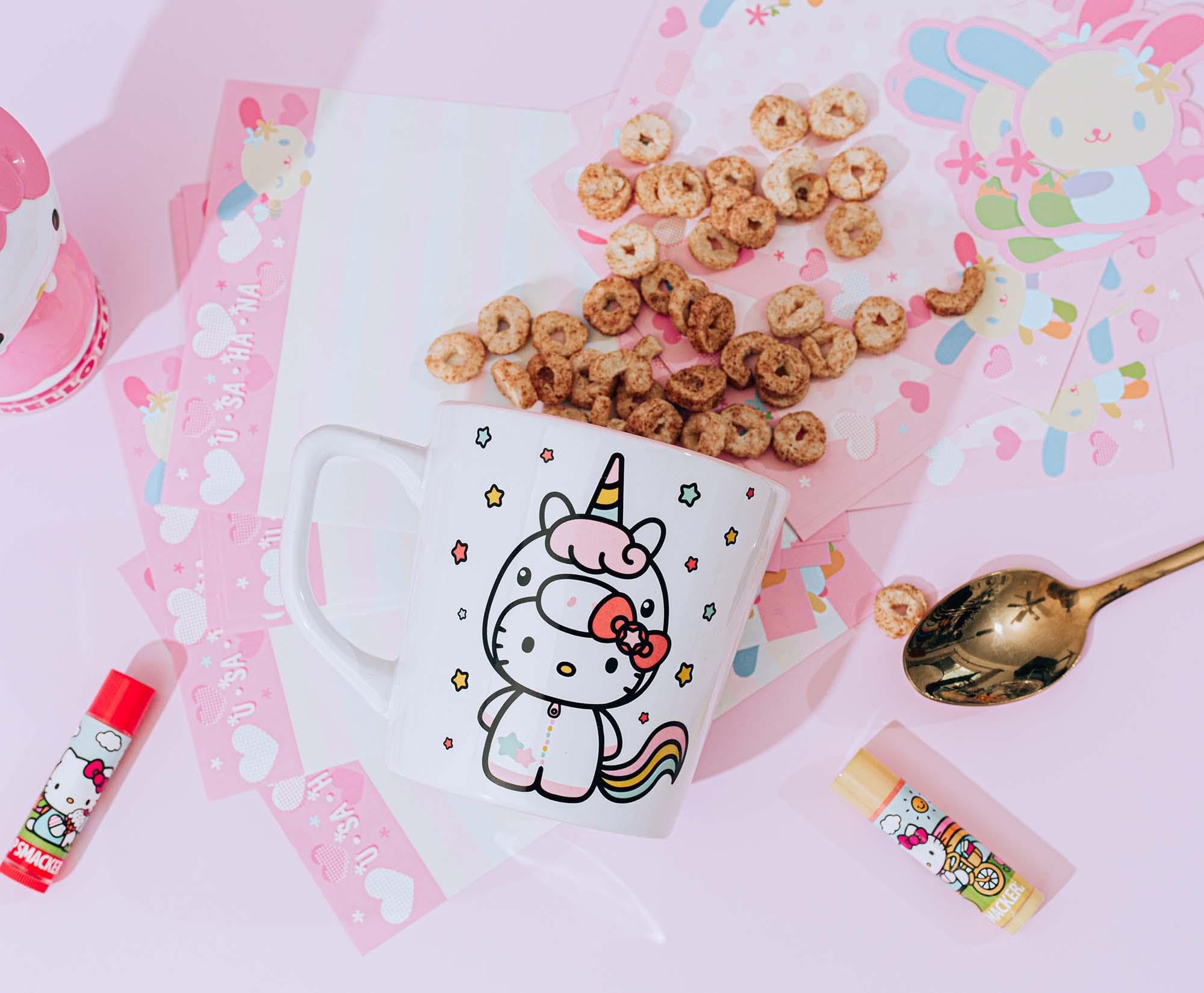 Silver Buffalo Hello Kitty Unicorn mug on a daily desk setup with latte.