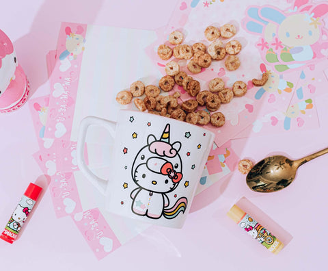 Silver Buffalo Hello Kitty Unicorn mug on a daily desk setup with latte.
