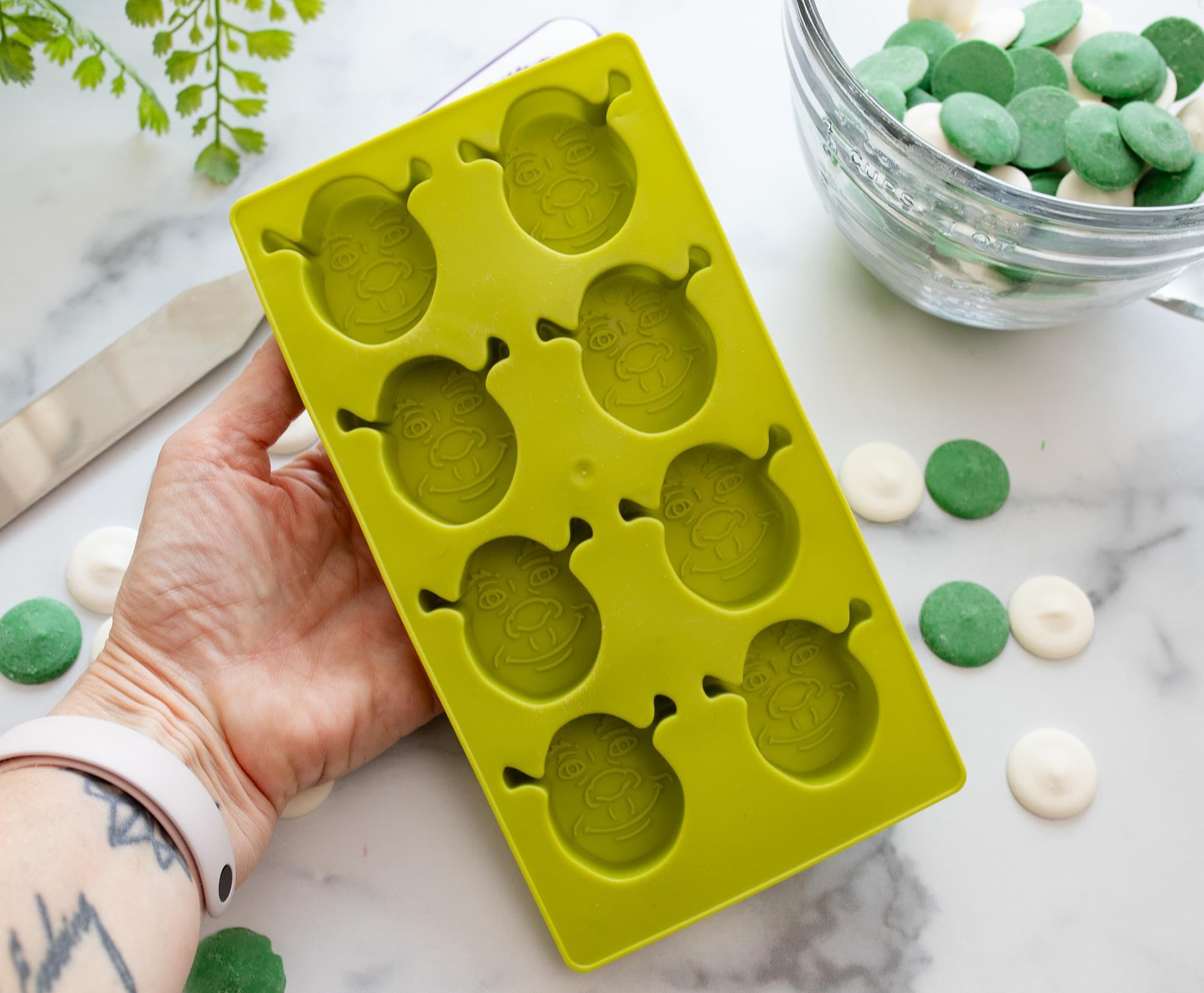 Eight-cube Shrek mold ideal for themed beverages and snacks.