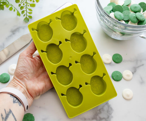 Eight-cube Shrek mold ideal for themed beverages and snacks.
