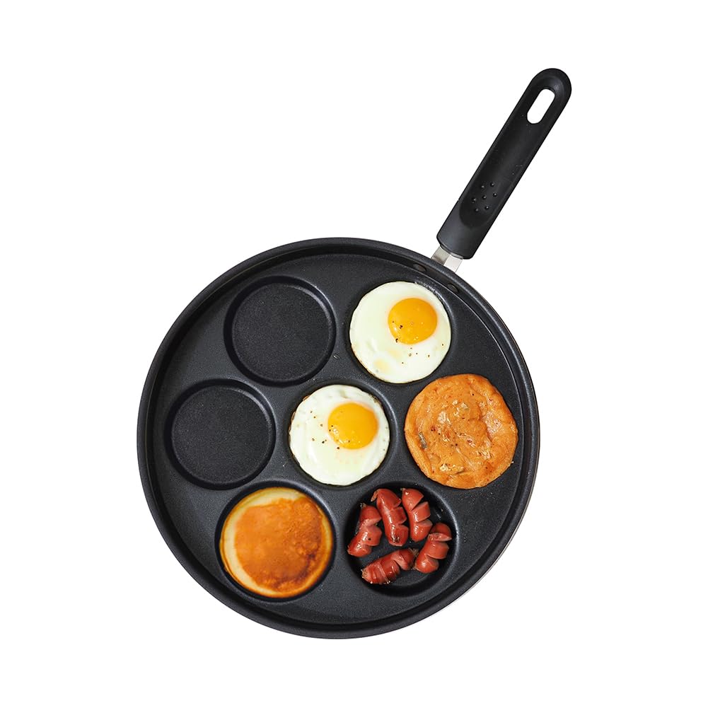 Sisem 7-Cup Eggpan cooks eggs and pancakes evenly with a non-stick surface.