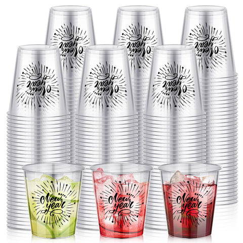 Sliner Happy New Year 2 oz shot glasses on table, clear plastic for parties