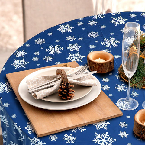 Sliner blue Christmas tablecloth serves as a versatile backdrop for holiday setups.