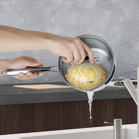 SLOTTET saucepan glass lid with dual strainer holes for easy draining.