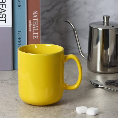 Smilatte large yellow mug with sturdy handle, perfect for tea or cocoa.