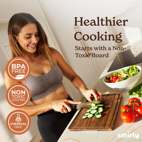 Ergonomic handles on SMIRLY cutting board for comfortable transport.