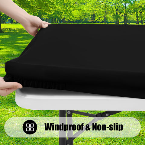 Smiry elastic edge fitted tablecloth secured on a table outside.