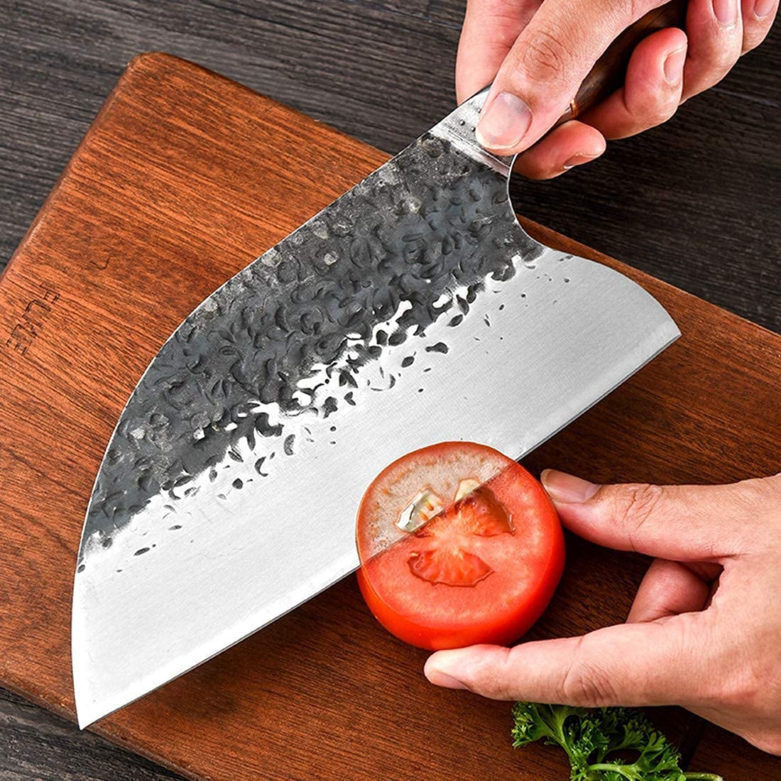 Smith Chu carbon steel edge retention supports long-lasting sharpness for meats and veggies.