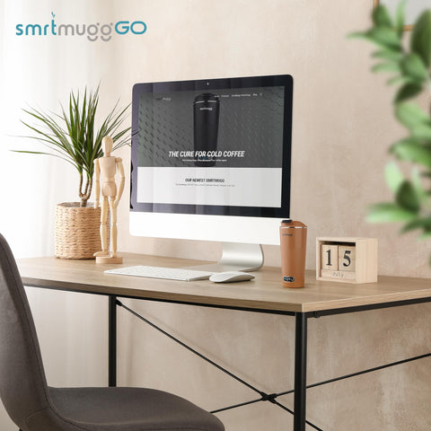 SmrtMugg GO mug on a desk ready to keep coffee warm all day