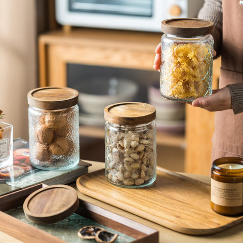 Snminetal jar with acacia lid for airtight freshness and vintage style.
