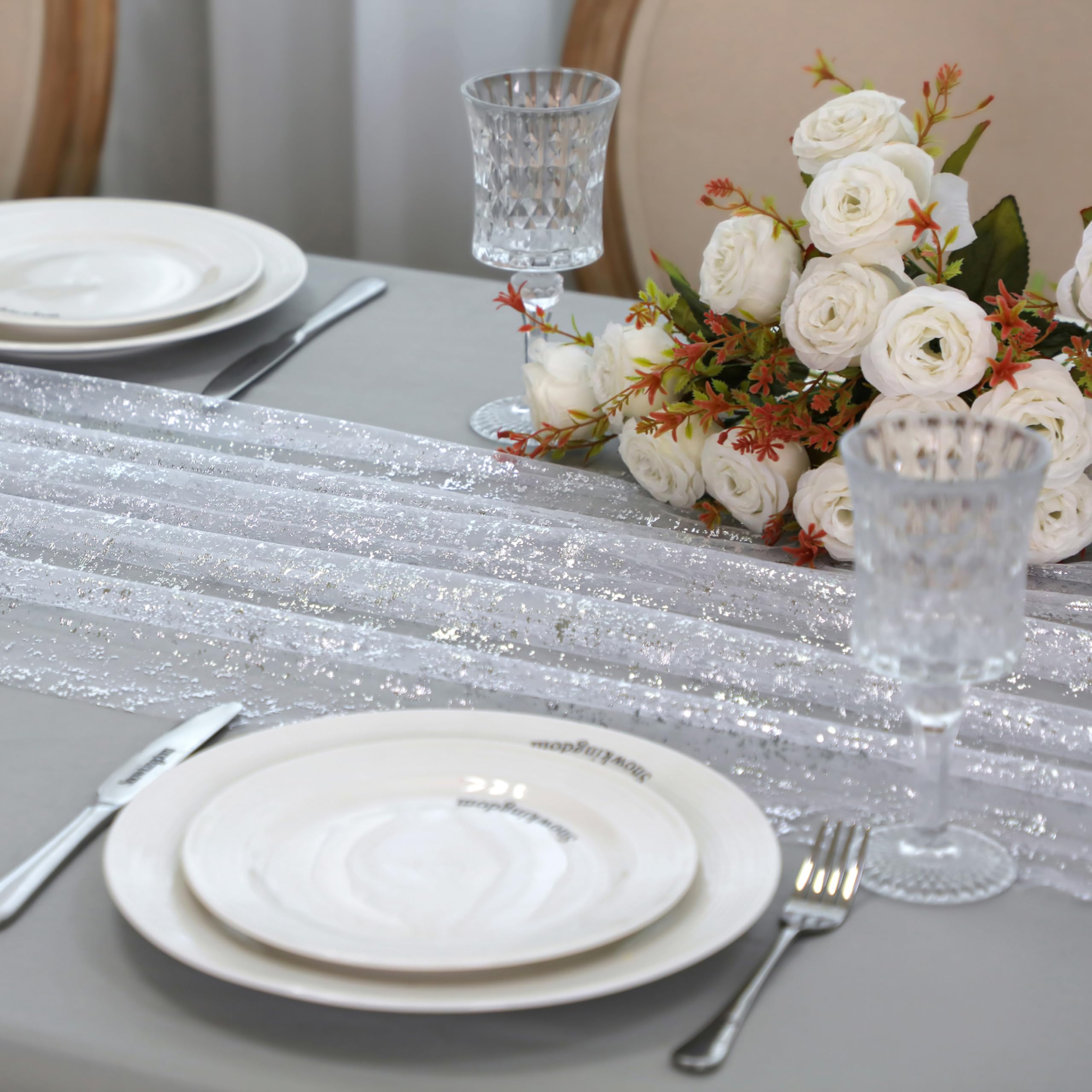 Snowkingdom bridal shower table runner complements silver decor and white linens.