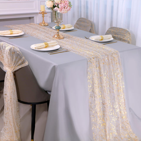 Snowkingdom gold table runner draped on banquet table for celebrations.