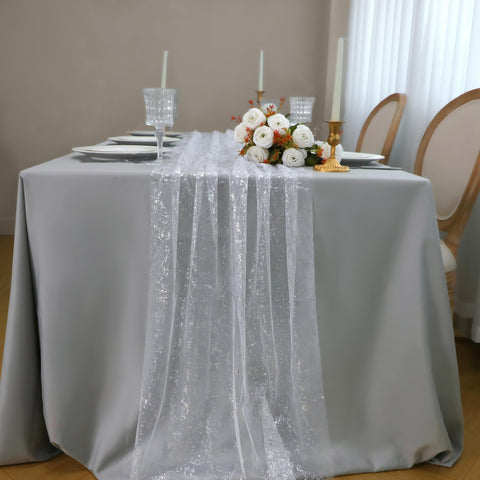 Snowkingdom sequin silver table runner brightens weddings and receptions with reflective shimmer.
