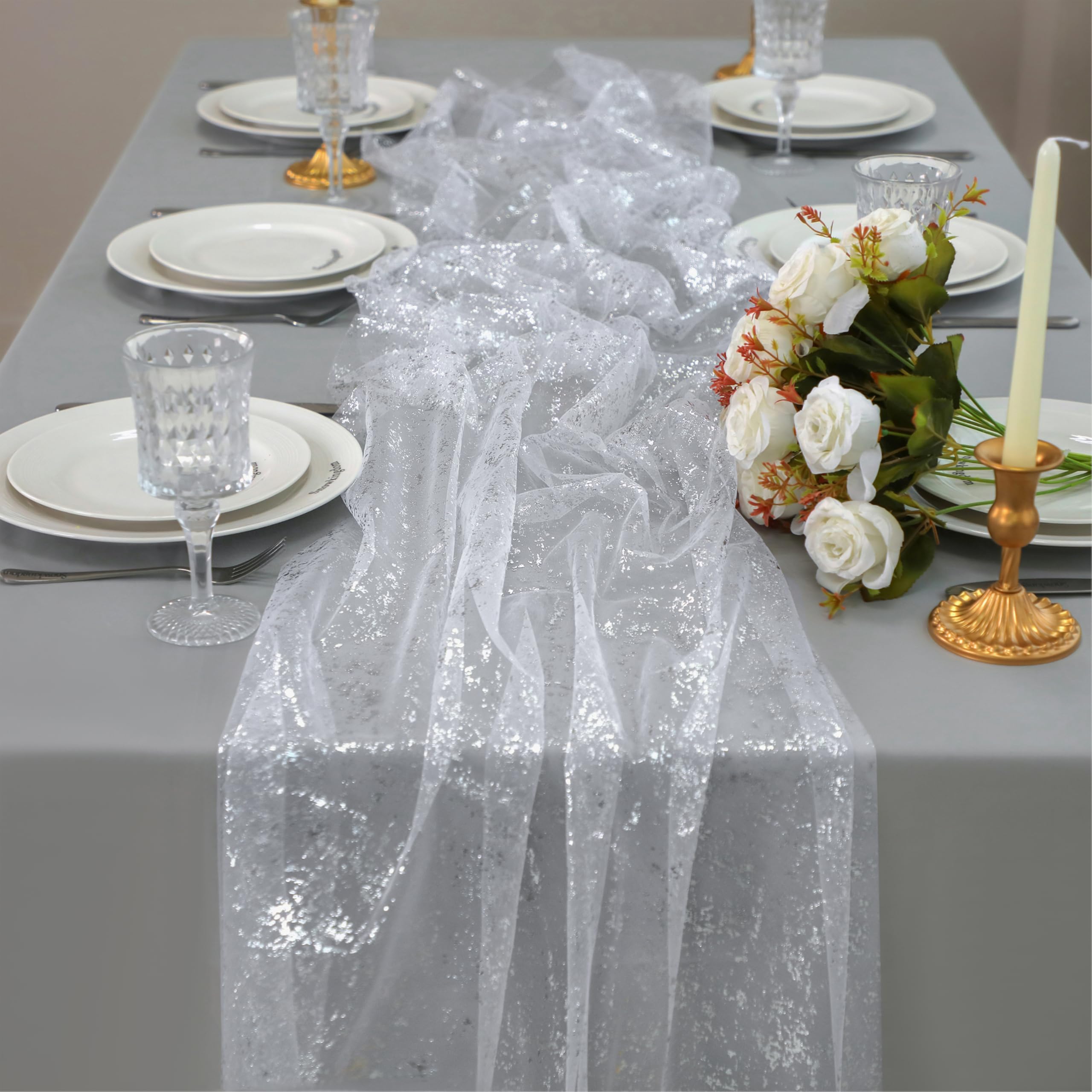 Snowkingdom silver cheesecloth table runner adds subtle sparkle to elegant tables.