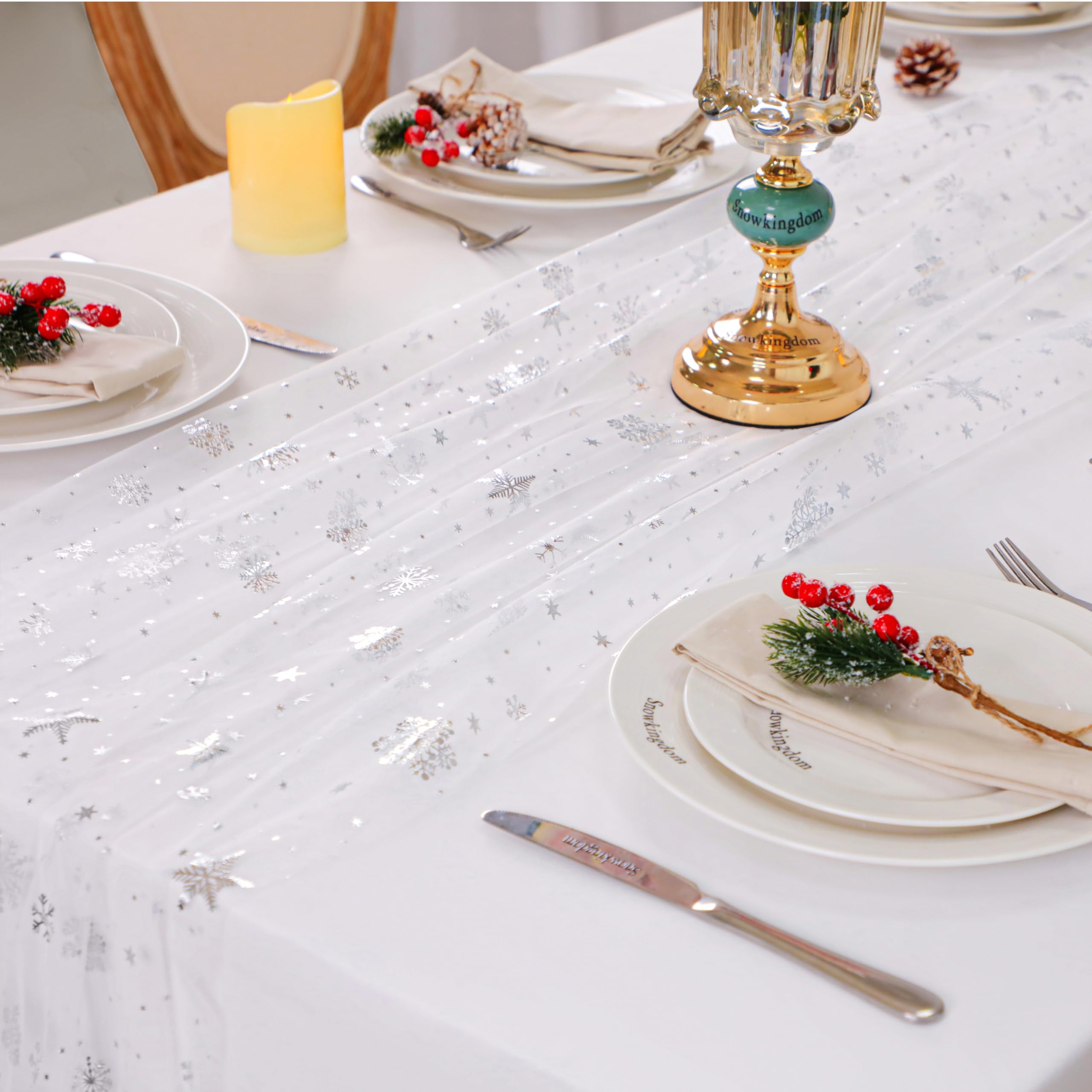 Snowkingdom mantel setup with snowflake runner creates cozy ambiance.