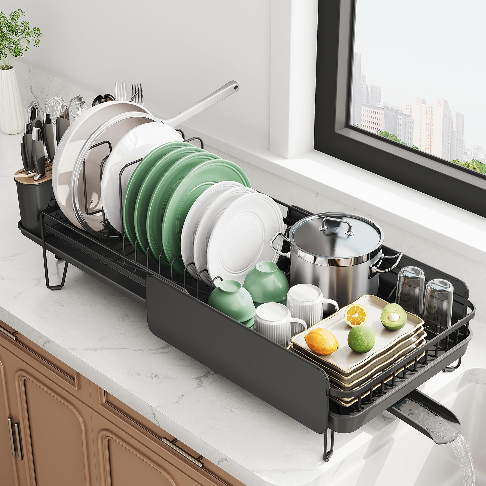 SNTD extendable dish drying rack on a compact counter with adjustable length.