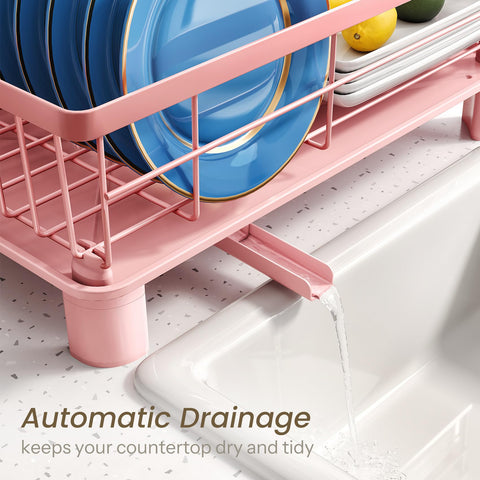 SNTD dish drying rack side angle in pink, shows compact footprint and legs.