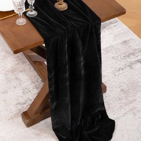 Socomi black velvet runner draped as a backdrop for festive holiday celebrations