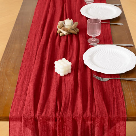 Socomi bridal shower decor with cheesecloth runner creates soft, airy ambiance.