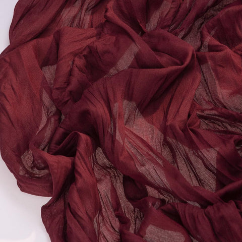 Socomi burgundy cheesecloth runner framing a wedding arch for a soft rustic backdrop