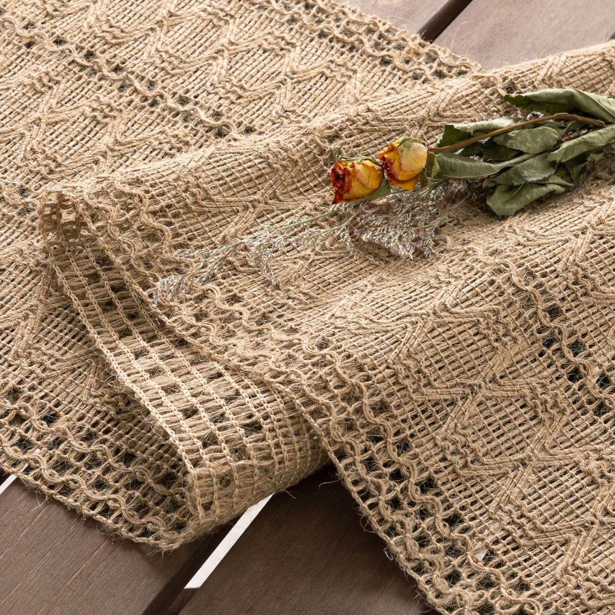 Socomi burlap table runner on dining table with warm rustic centerpiece