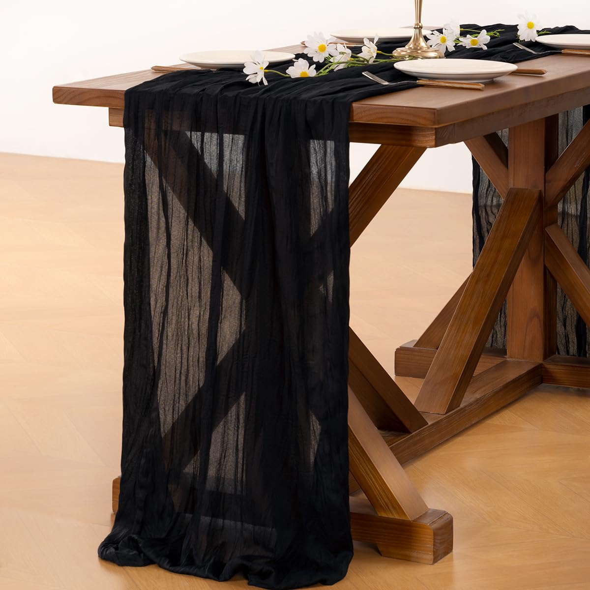 Socomi black cheesecloth runner ready for holiday table setups.